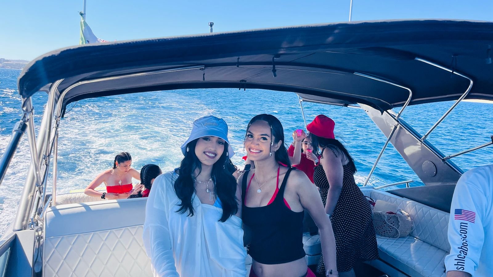 Friends enjoying open bar on a private yacht in Cabo