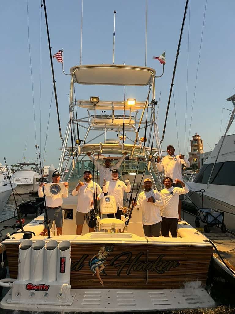Cabo 35 ft sportfishing boat and crew at the marina