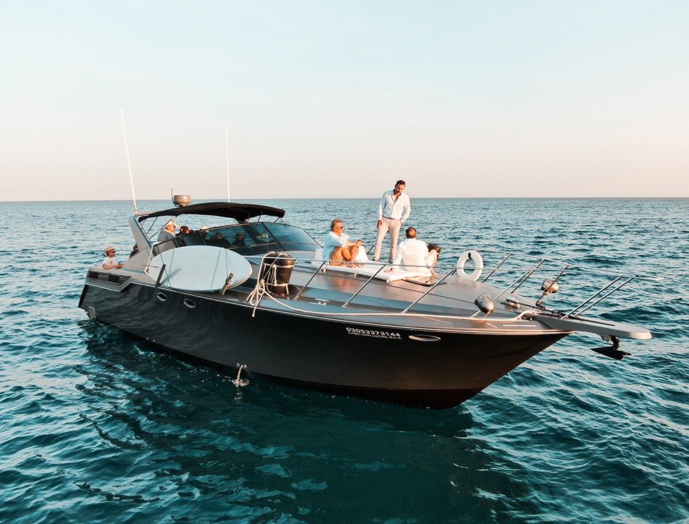 All-inclusive 46 ft luxury yacht cruising at sunset in Cabo