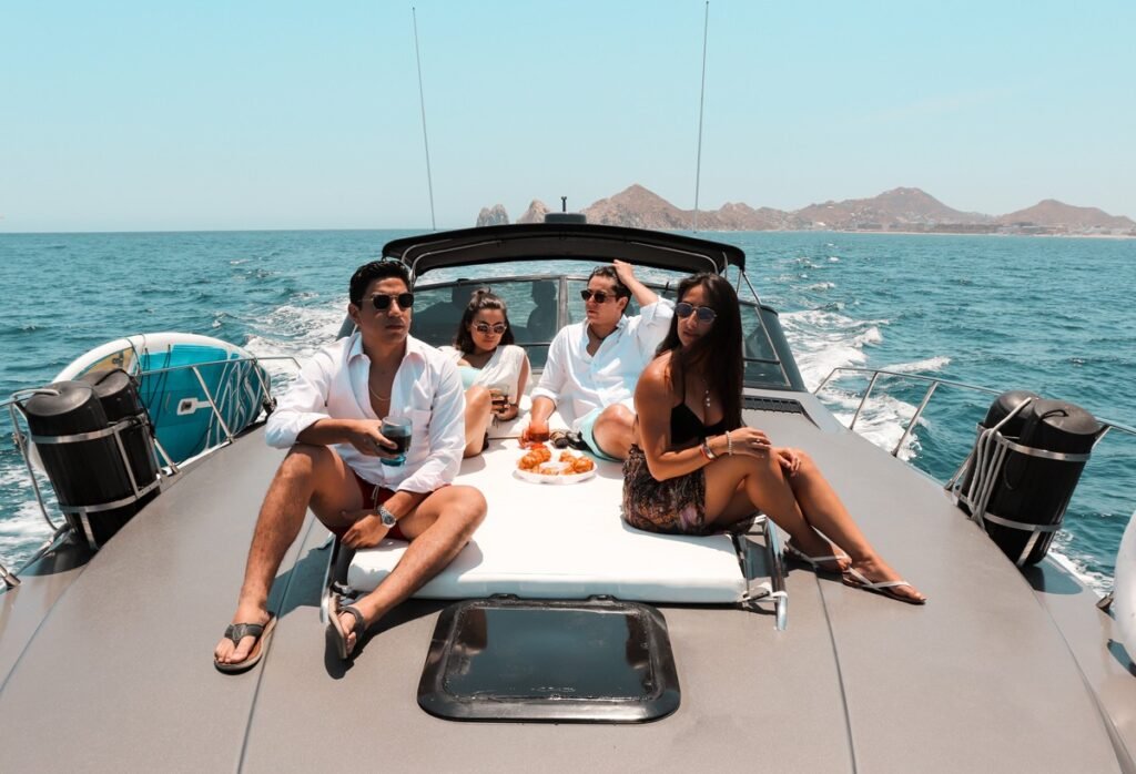 Couple relaxing on the bow of a 46 ft yacht in Cabo